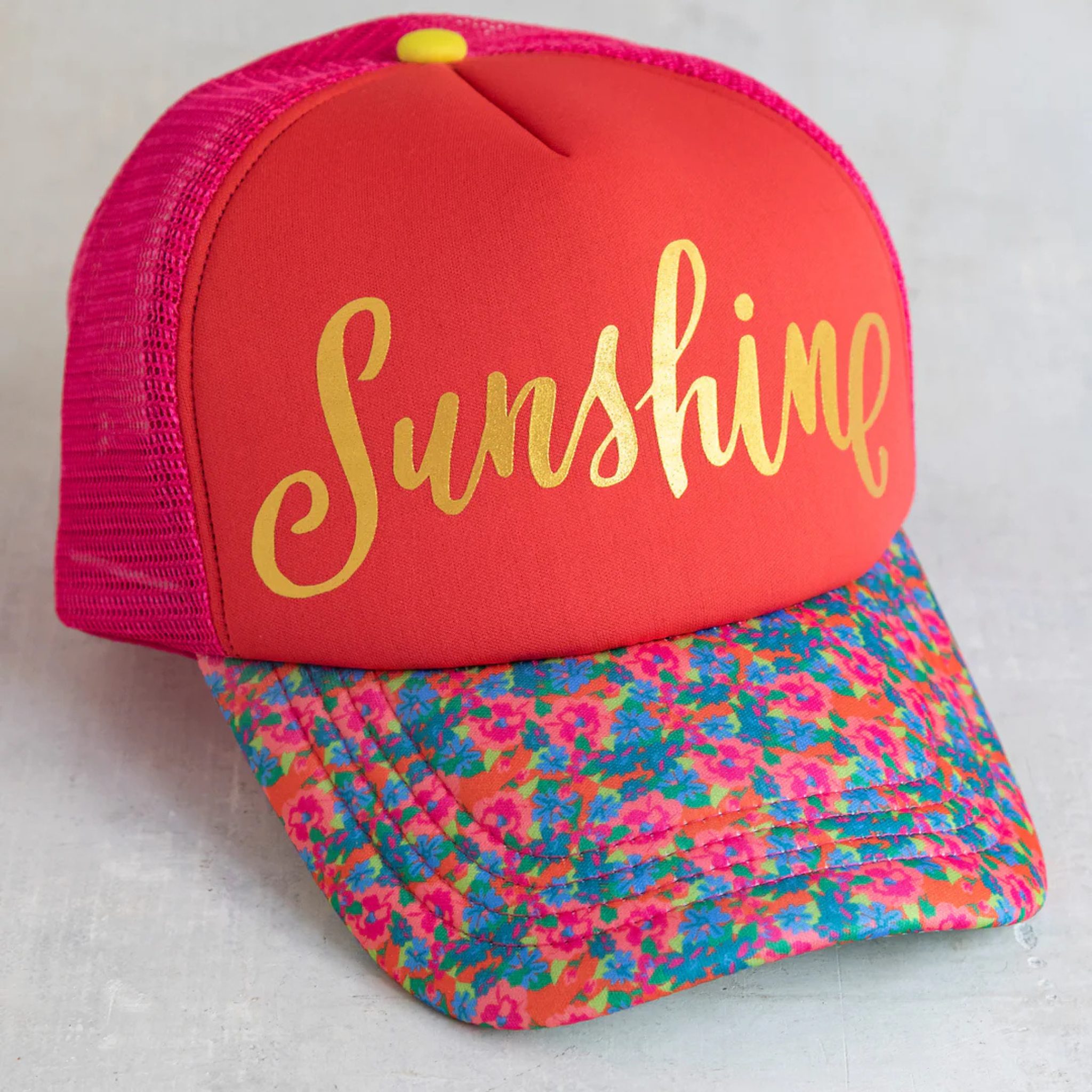 Adjustable Natural Life trucker hat in bright sunshine yellow with a mesh back and curved brim.