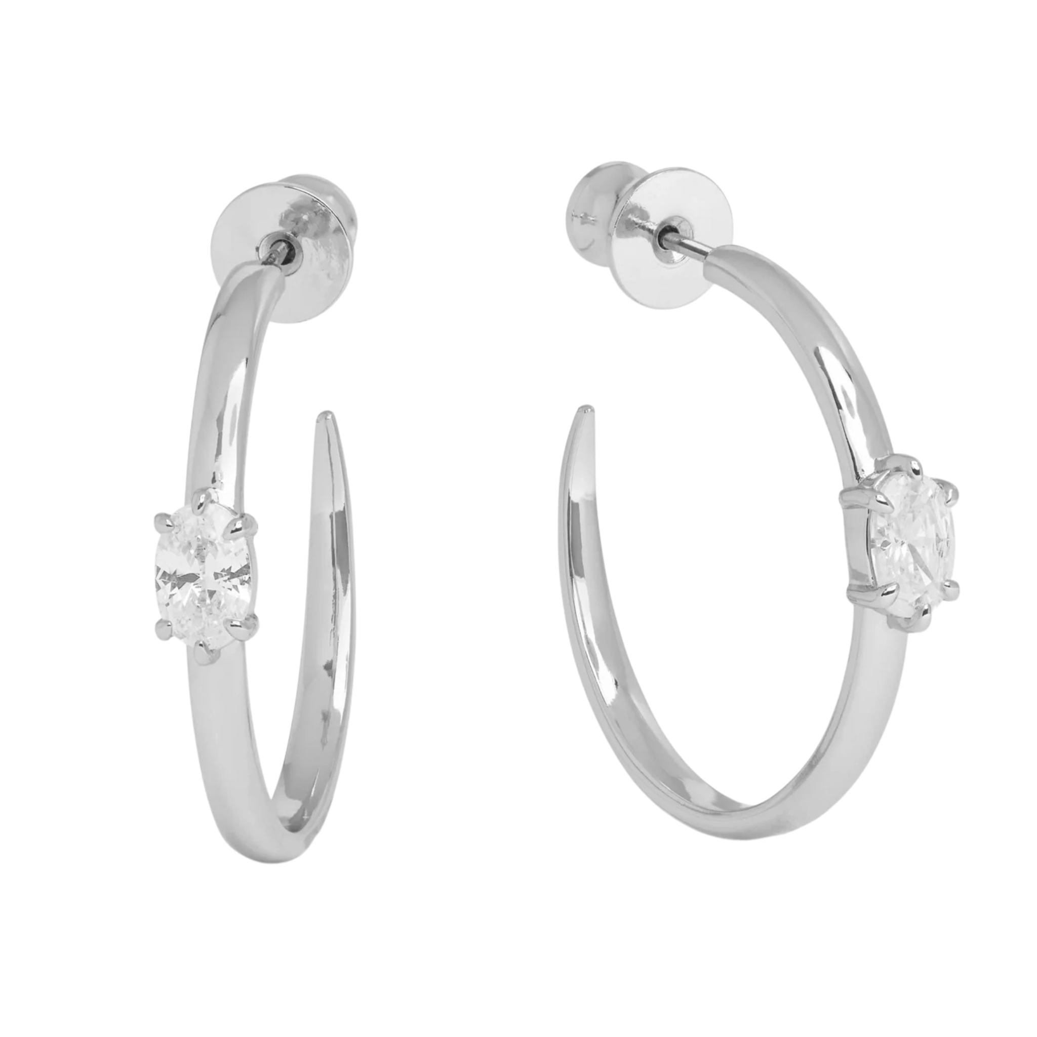 Silver 1-inch She’s on Point Hoops earrings by Melinda Maria featuring white diamondette accents and hoop design.