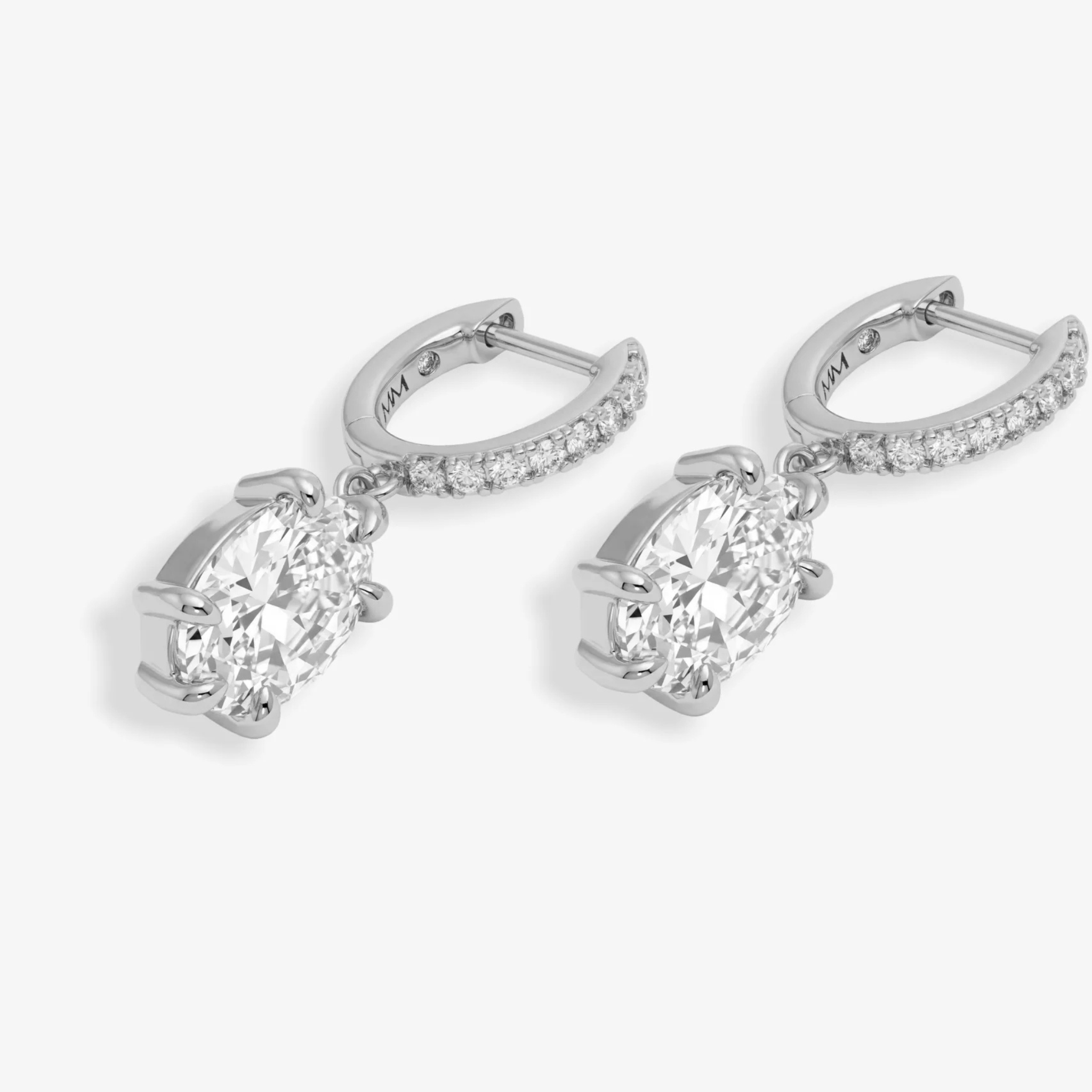 Silver She’s On Point earrings by Melinda Maria featuring white diamondette accents and a sleek, modern design.
