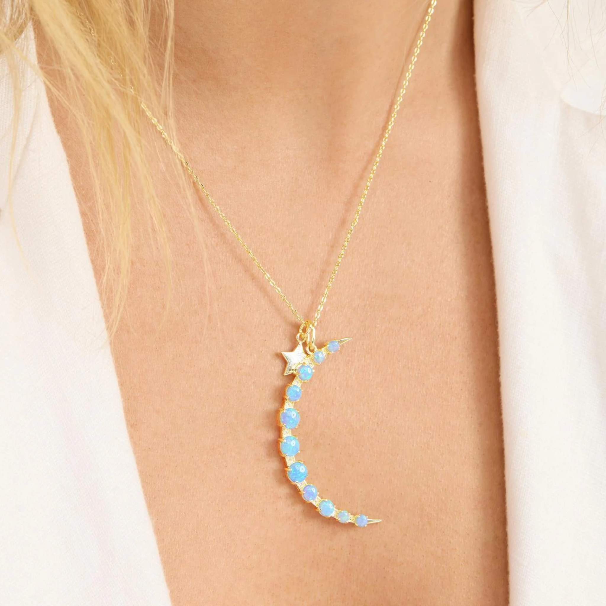 Gold "What Dreams are Made of" necklace by Melinda Maria featuring a blue opal pendant on a delicate chain.