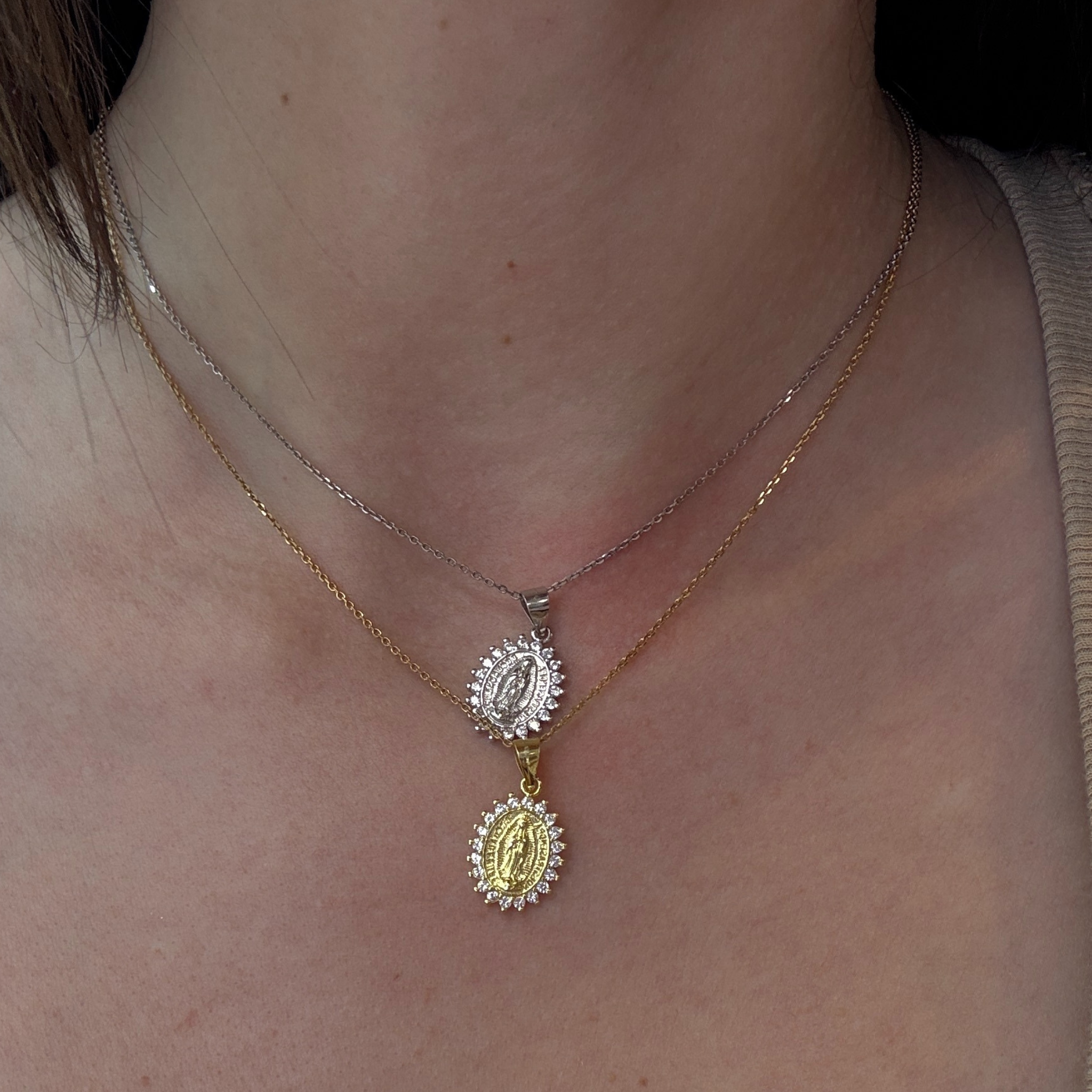 Sterling silver Mother Mary necklace from Private Label Jewelry featuring a detailed religious pendant on a delicate chain.
