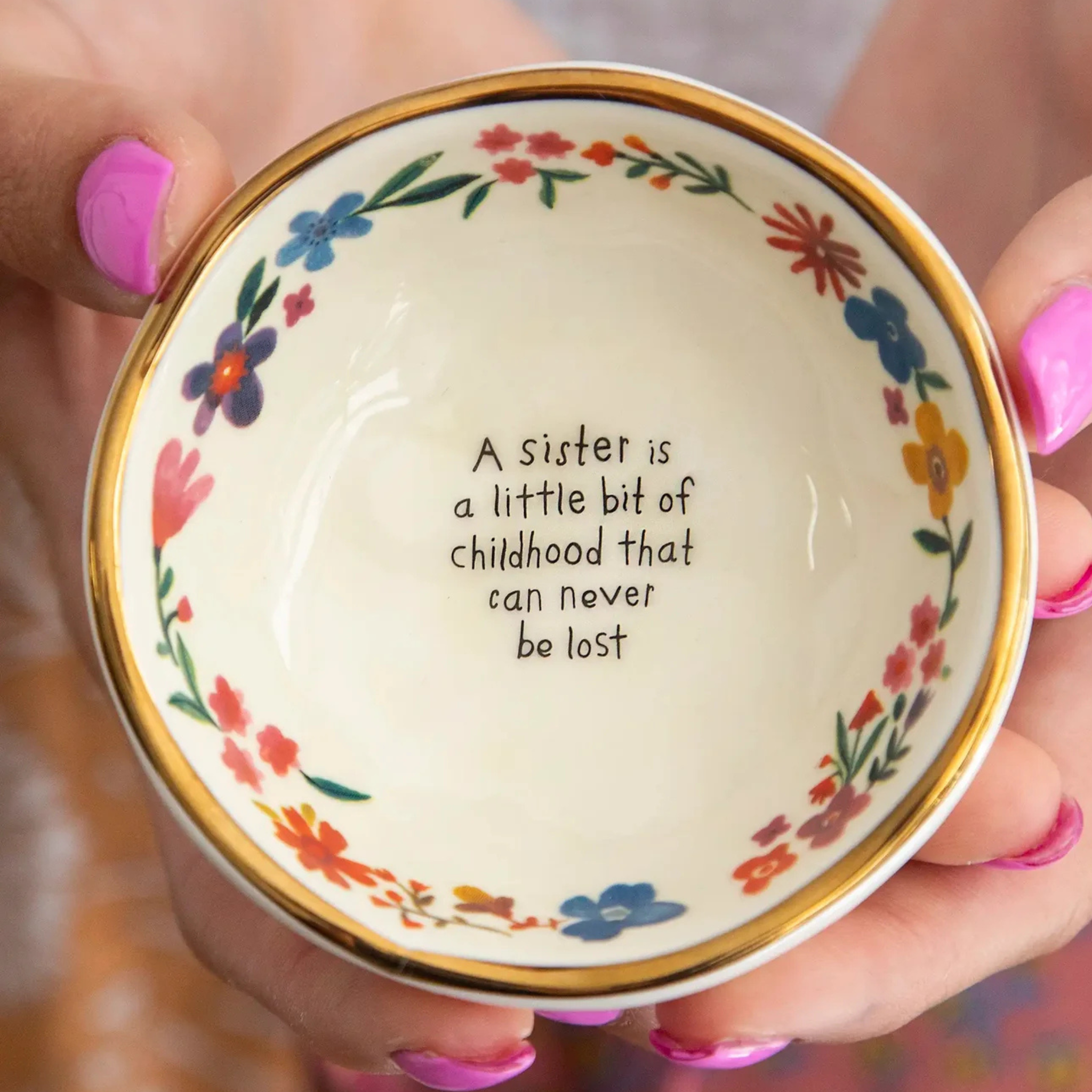 Ceramic trinket bowl by Natural Life featuring a whimsical design celebrating sisterhood and childhood memories.
