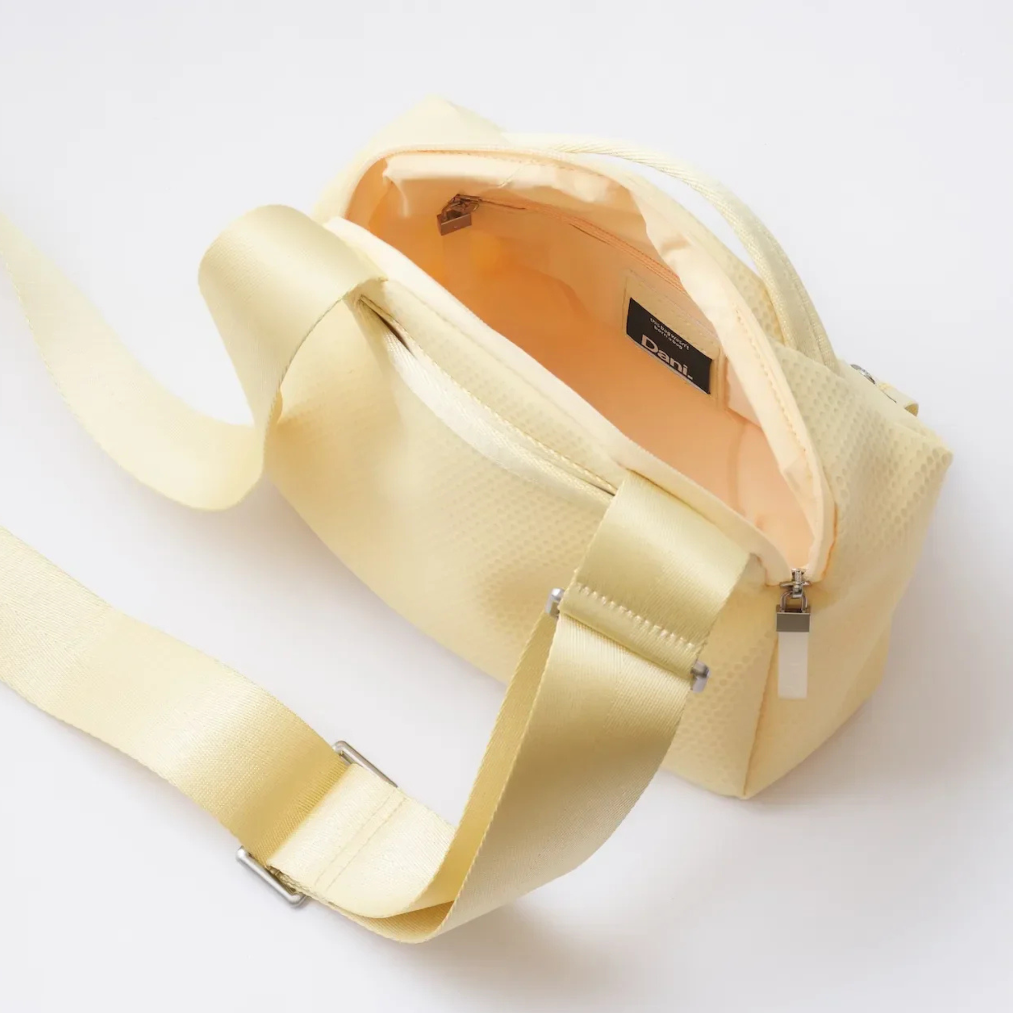 Daniella Lehavi Bonnie crossbody bag with sleek leather design and adjustable strap, displayed on a neutral background.