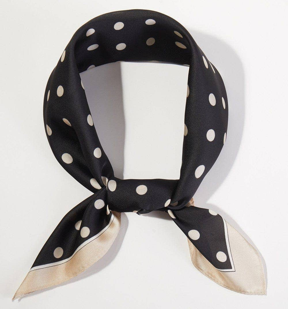 Black polka dot scarf on a white background