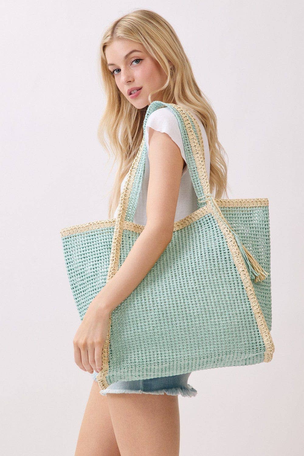 Two Tone Woven Straw Beach Tote Bag with sturdy handles and a spacious interior, perfect for summer outings.