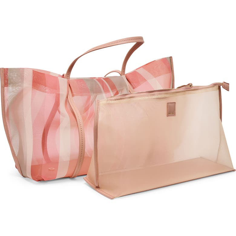 Dolce Vita Aislin Coral Stripe Mesh Tote bag with breathable mesh fabric and sturdy handles, perfect for beach outings.