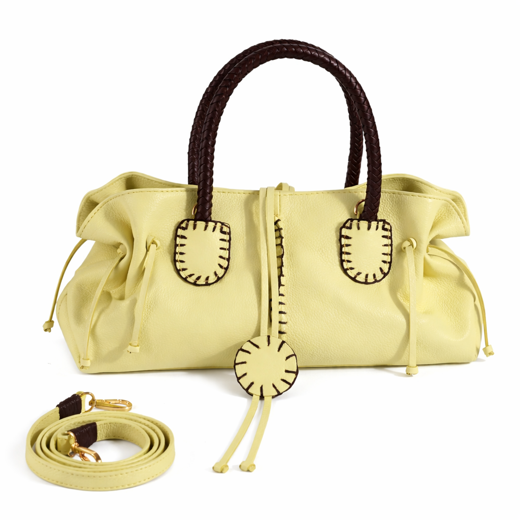 Carlos Falchi mini satchel bag with a sleek design and textured material, featuring a top handle and adjustable shoulder strap.