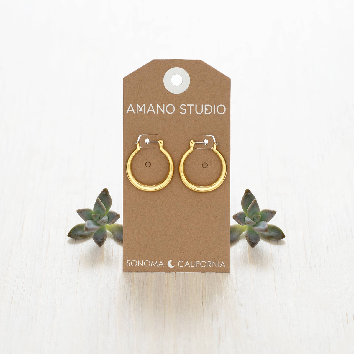 Small Maria hoop earrings by Amano Studio featuring delicate silver hoops with subtle detailing for a minimalist look.