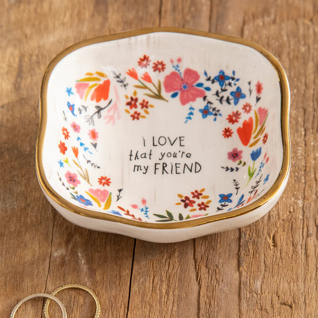 Antiqued trinket bowl by Natural Life with intricate design, perfect for holding small items or jewelry.