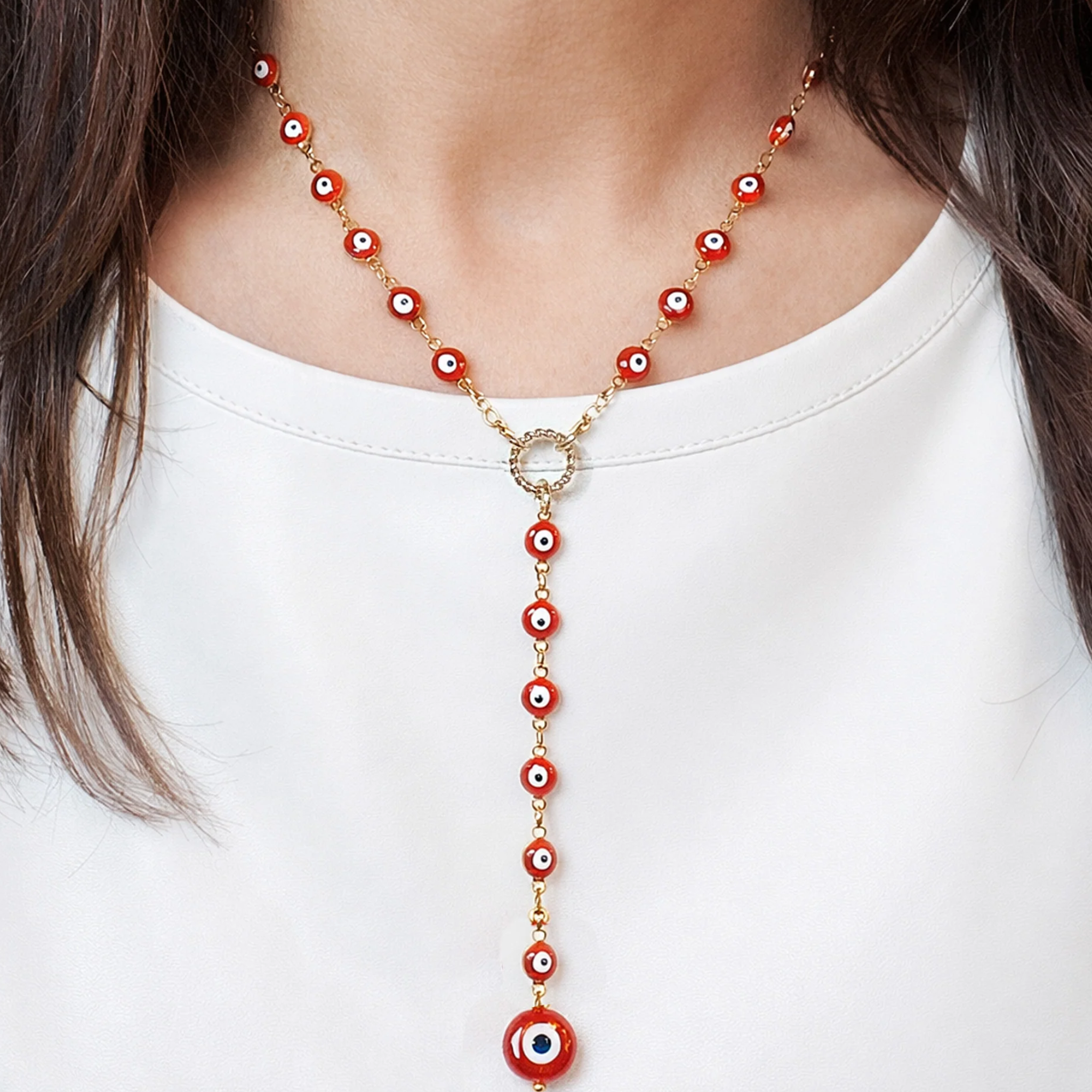 Love Lisa Lucia Evil Eye Y Necklace featuring a sleek gold chain and evil eye pendant, stylish jewelry for protection and fashion.