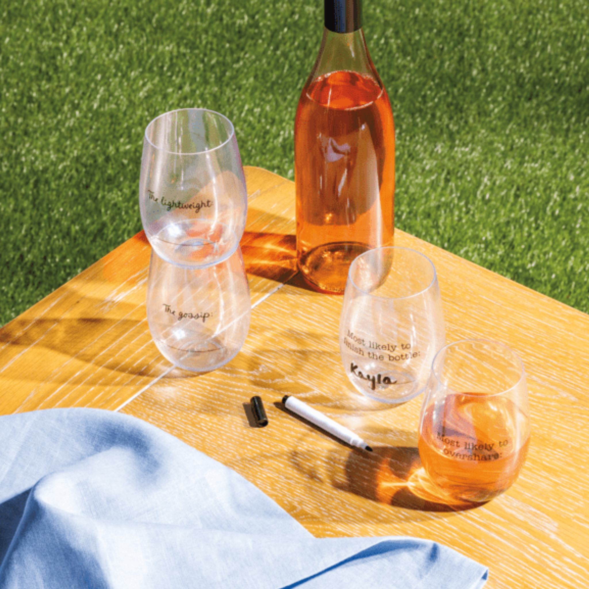 Mudpie Most Likely Wine Cups and Marker Set, clear drink glasses with black markers for personalized wine tasting.