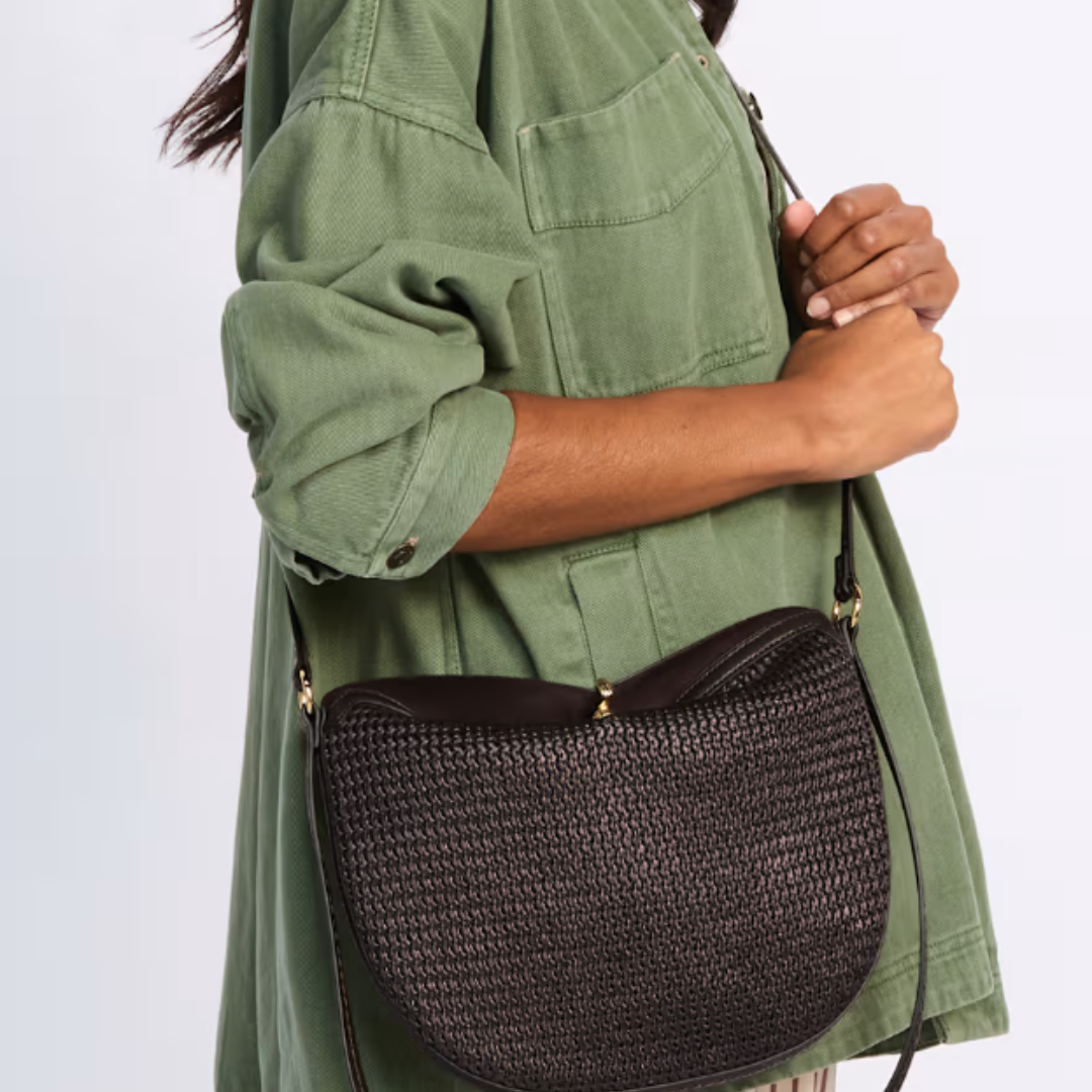 Brown raffia slouchy fold-over bag by Dolce Vita, featuring a relaxed design and textured surface.