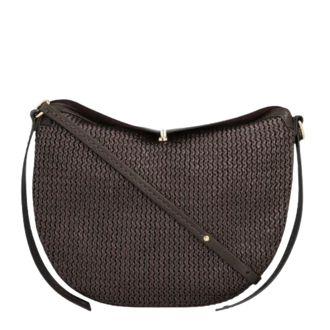 Brown raffia slouchy fold over bag by Dolce Vita, showcasing a relaxed design and textured surface.