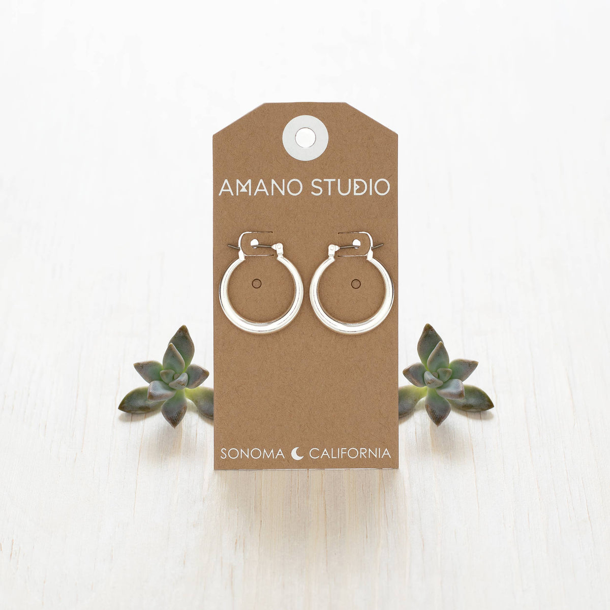 Small Maria hoop earrings by Amano Studio, delicate gold hoops with a sleek, minimalist design perfect for everyday wear.