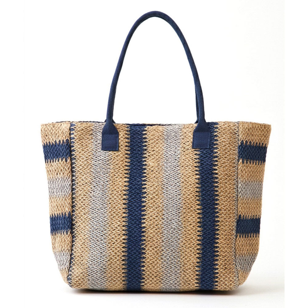 Natural multi-color stripe straw tote bag from Sensibling Corp., ideal for beach outings, showing woven straw texture and colorful stripes.