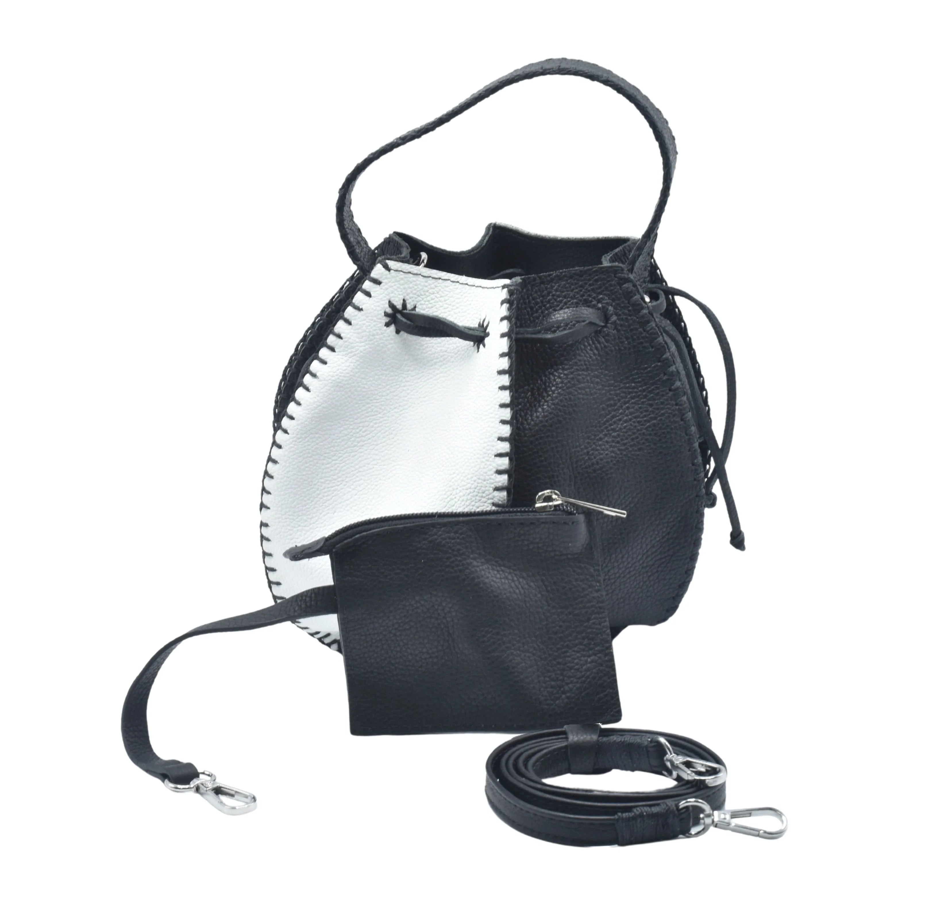 Black tall bucket bag by Carlos Falchi, featuring a sleek design and structured shape, shown in a black and white photo.
