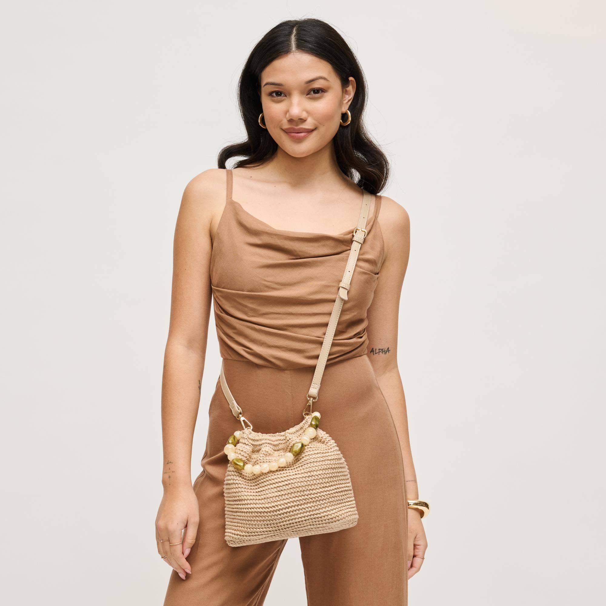 Urban Expressions Emery Crossbody bag with adjustable strap and multiple compartments, shown in black leather.