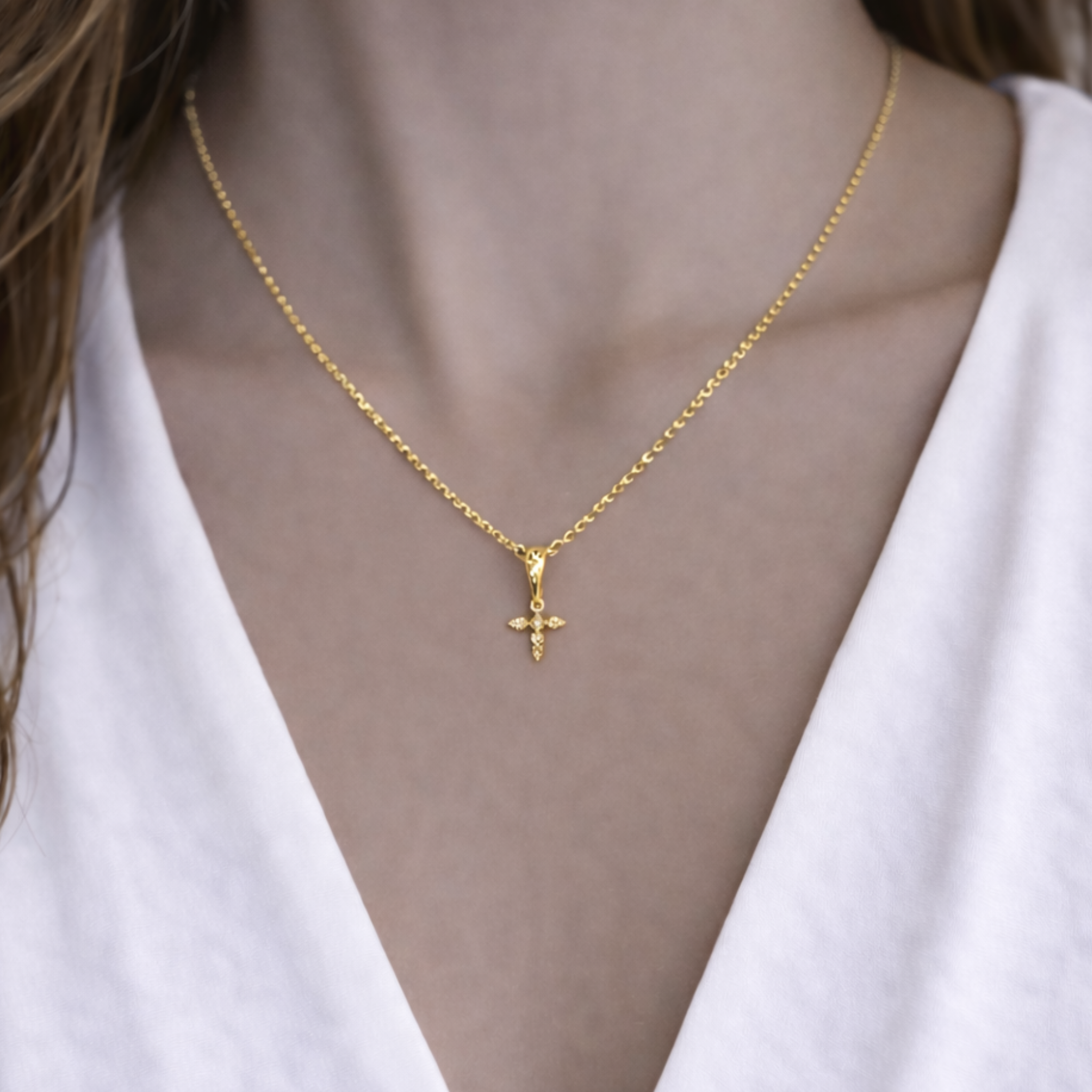 Pointed off cross necklace by Private Label featuring a sleek design with a delicate chain and elegant cross pendant.