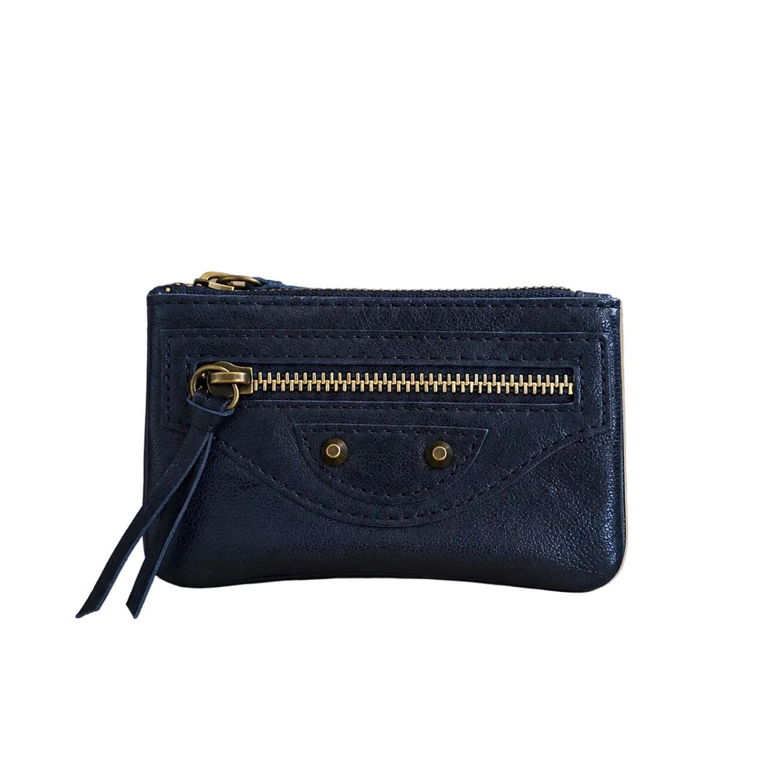 Blue wallet with gold zipper on a beige background