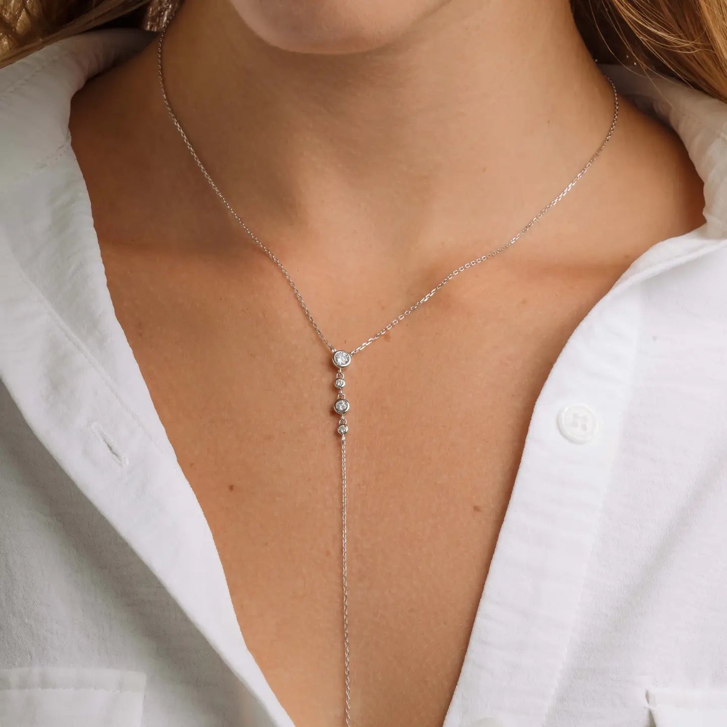 Silver Bezel Lariat Necklace with a sleek, modern design, featuring a minimalist pendant on a delicate chain.