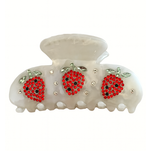 Decorative hair clip with red floral designs and gold accents on a white background