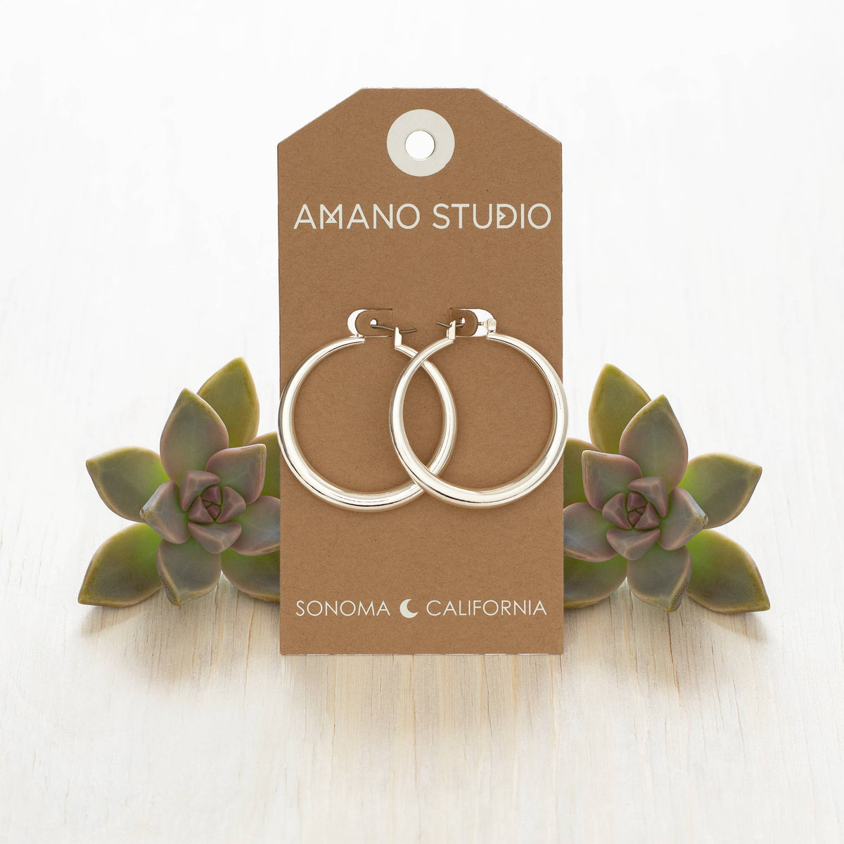 Large Maria hoops earring by Amano Studio featuring bold, circular gold hoops with a smooth finish.
