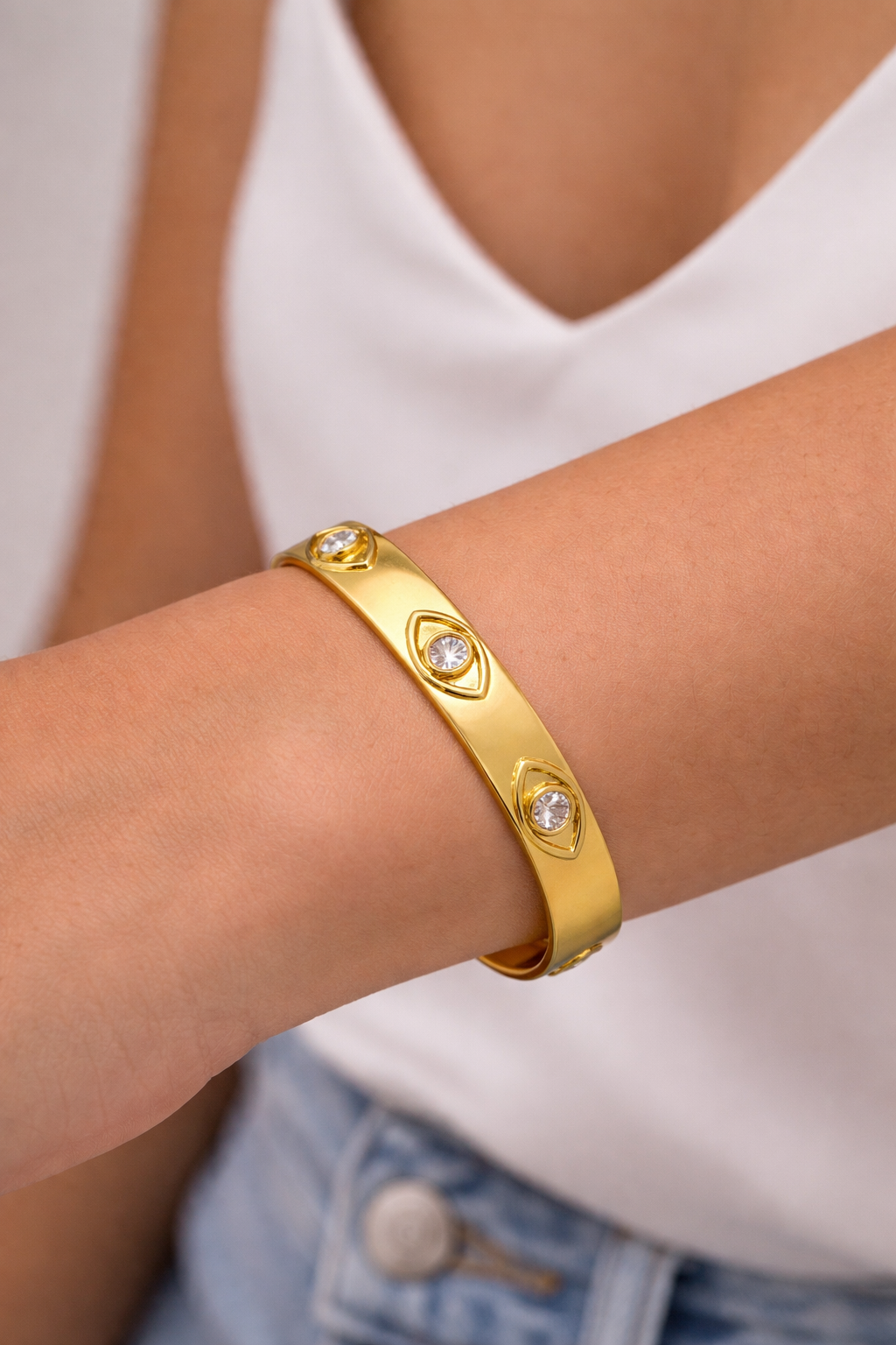 The Skylar Project bangle bracelet featuring an evil eye design in a sleek, elegant style.