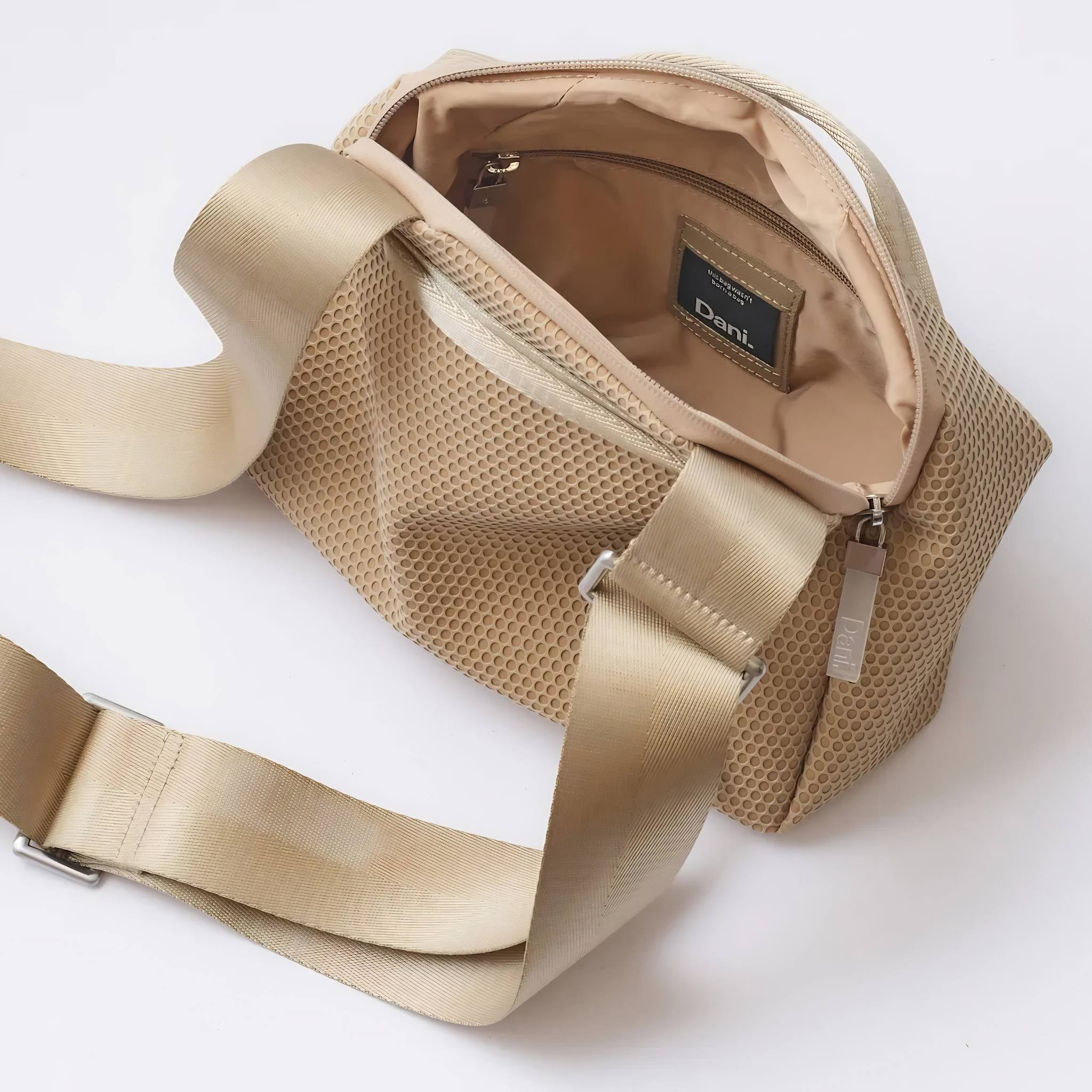 Daniella Lehavi Bonnie Crossbody bag in black leather with adjustable strap and gold-tone hardware on a plain background.