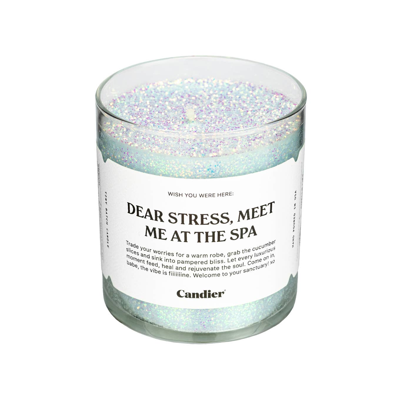 Candier Meet Me At The Spa Candle with a white wax finish, relaxing spa scent, and minimalist glass holder.