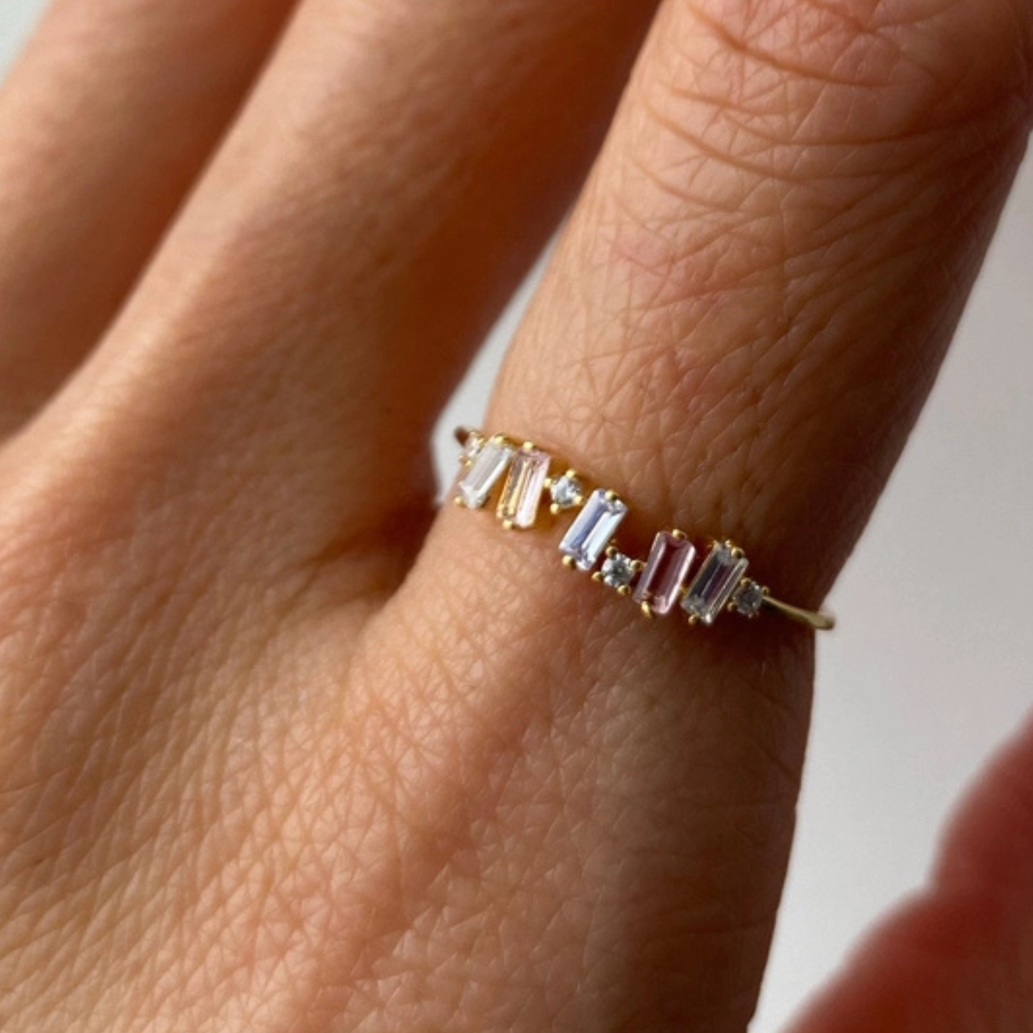 Private label Baguette Ombré ring with a sleek, multicolored gemstone design in a stylish ring setting.