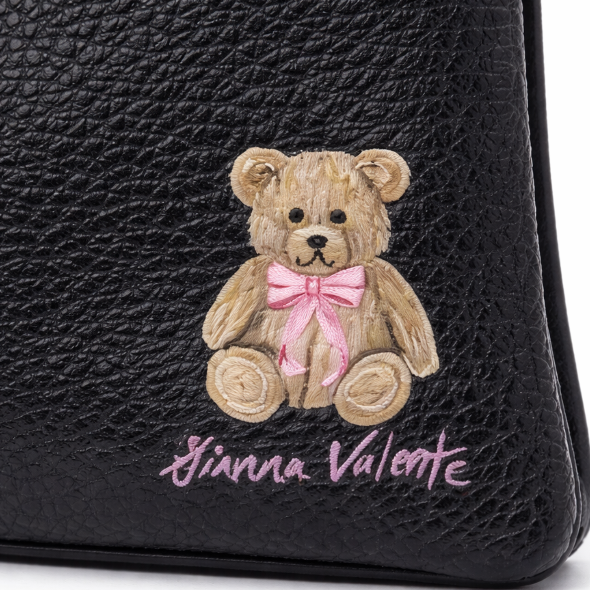 Hand-painted Gianna Valente wristlet from the Hand-Painted Wristlet Collection with colorful floral design and sleek leather finish.