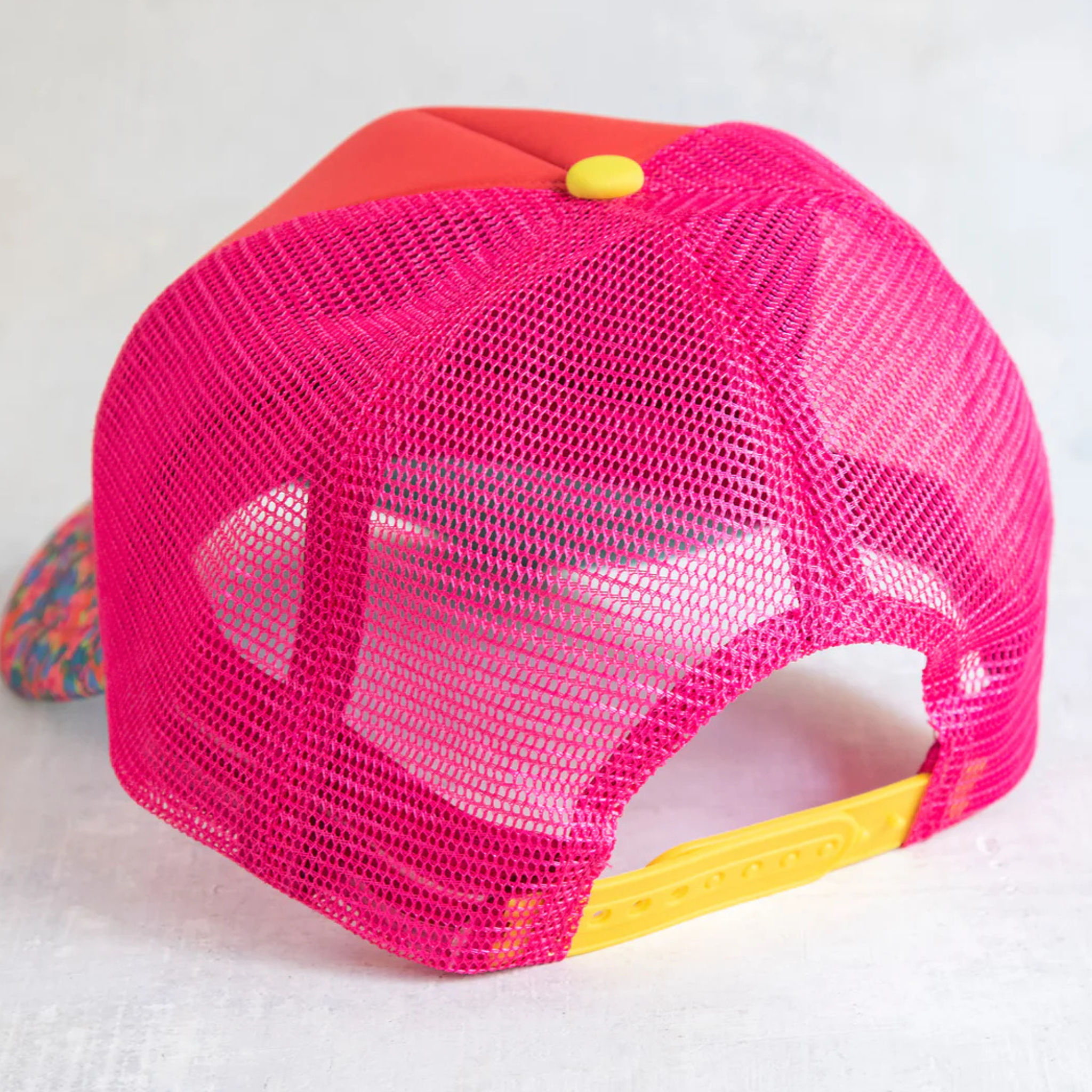 Adjustable Natural Life trucker hat in vibrant Sunshine color with mesh back and curved brim.