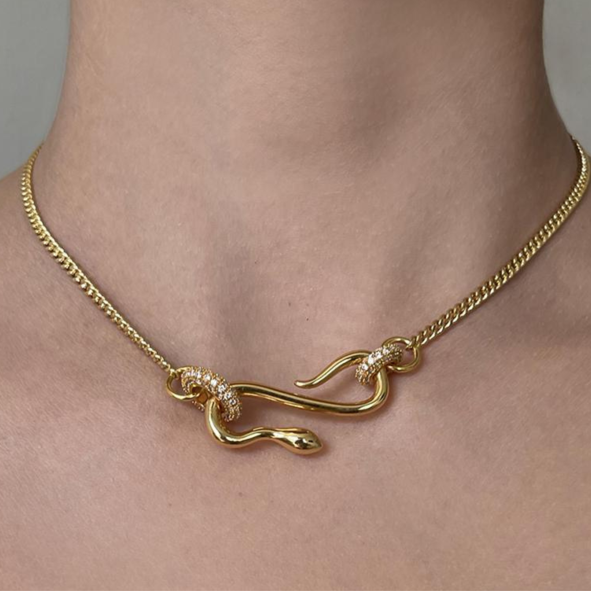 Rhinestone snake-shaped chain pendant necklace with sparkling stones, crafted by Private Label, showcasing a unique jewelry design.