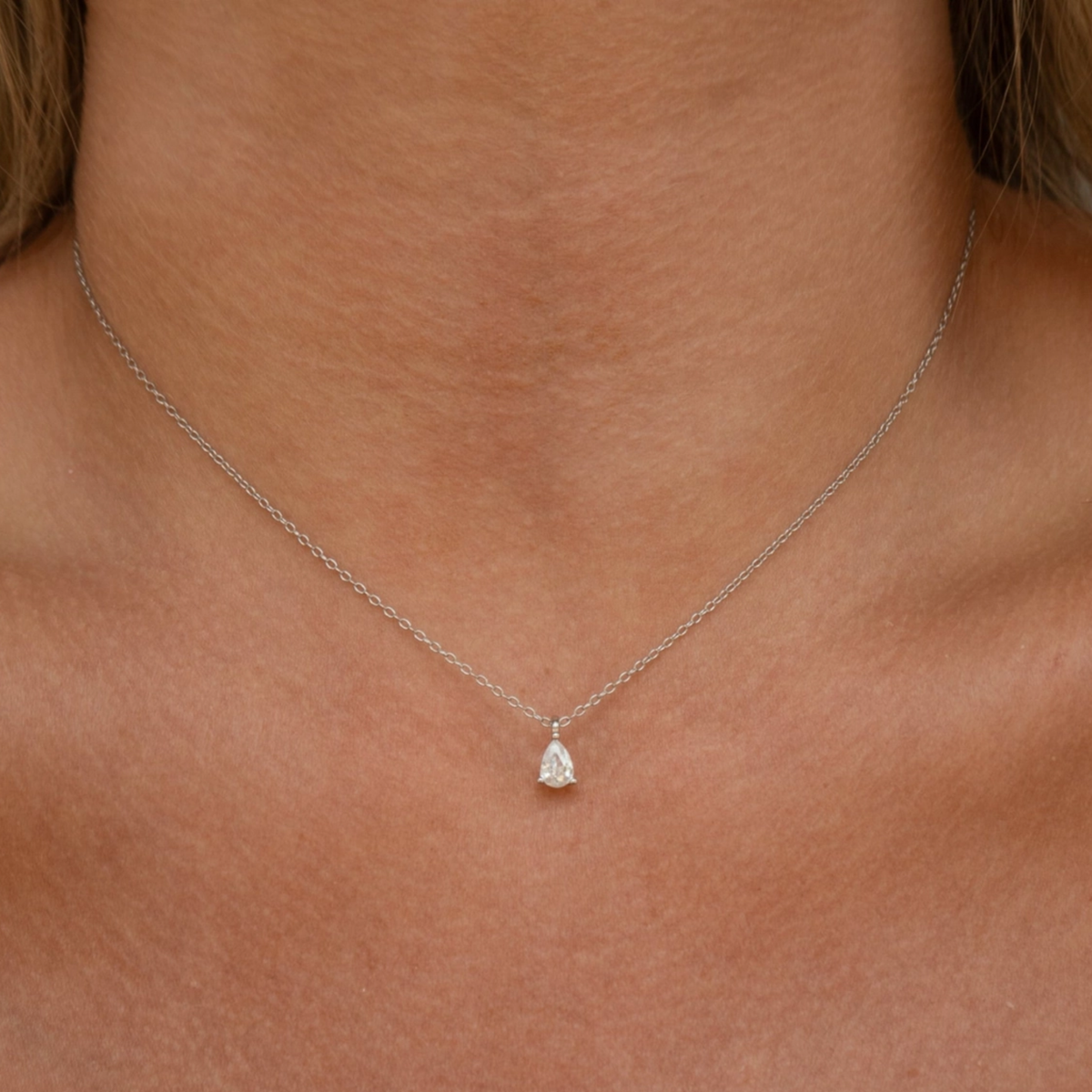 Silver Demi Necklace by JacqMaria Jewelry featuring a delicate chain and elegant pendant on a white background.