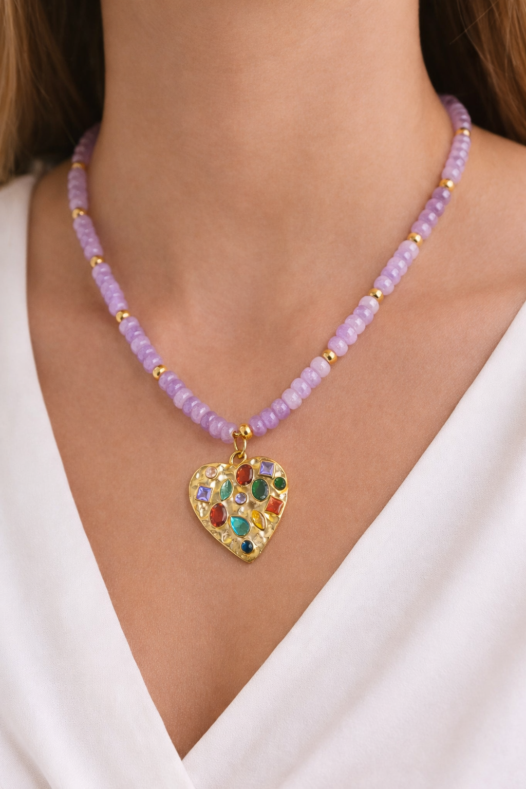 Lilac beaded confetti heart necklace by BELJOY displayed on a neutral background, showcasing its colorful design.