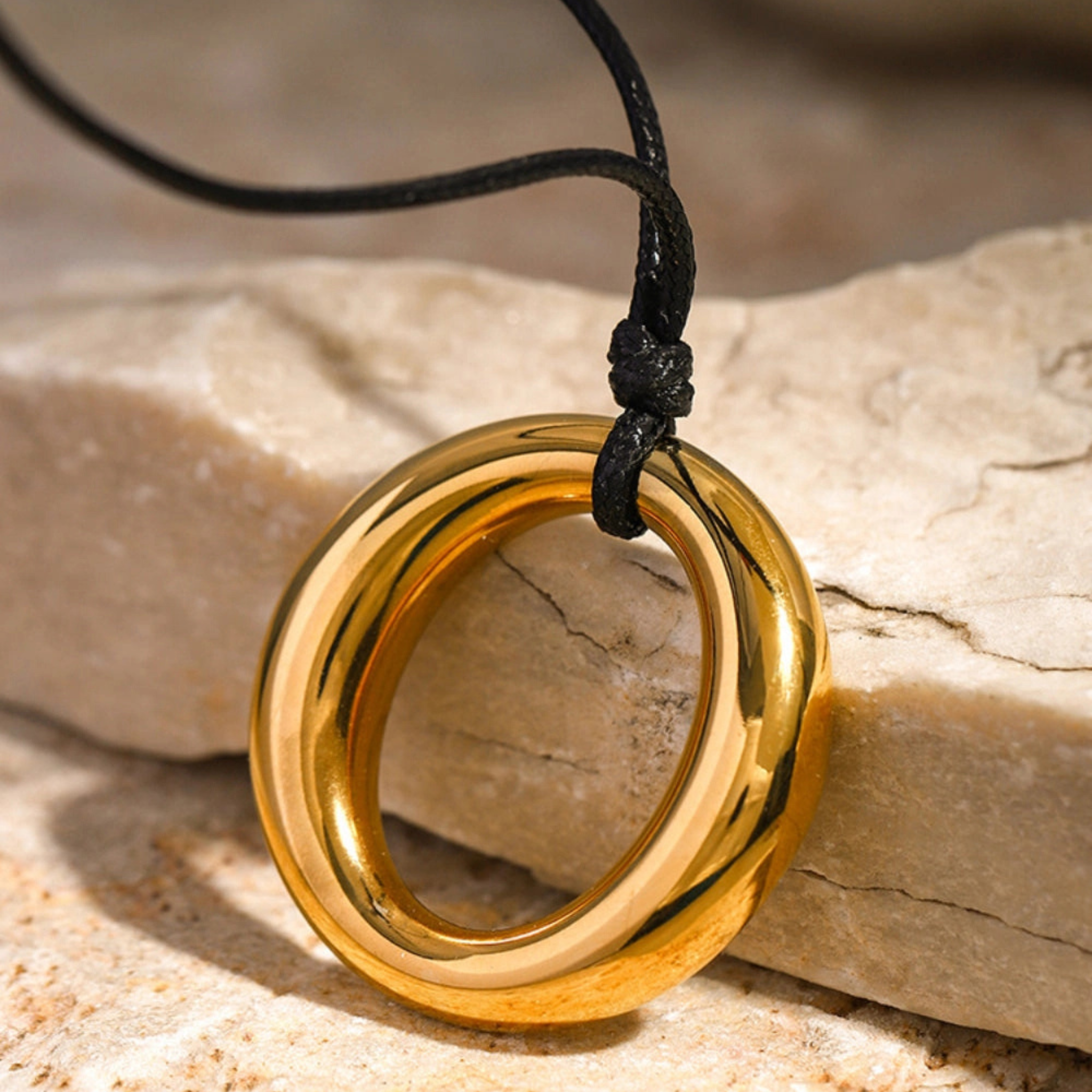 Simple round cutout titanium necklace featuring a sleek, minimalist design with a smooth, polished finish.