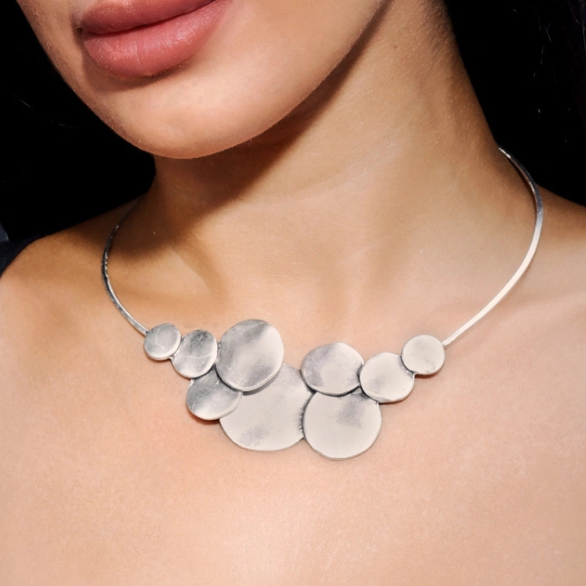 Chanour moonphase necklace featuring a delicate pendant with moonphase design on a silver chain.