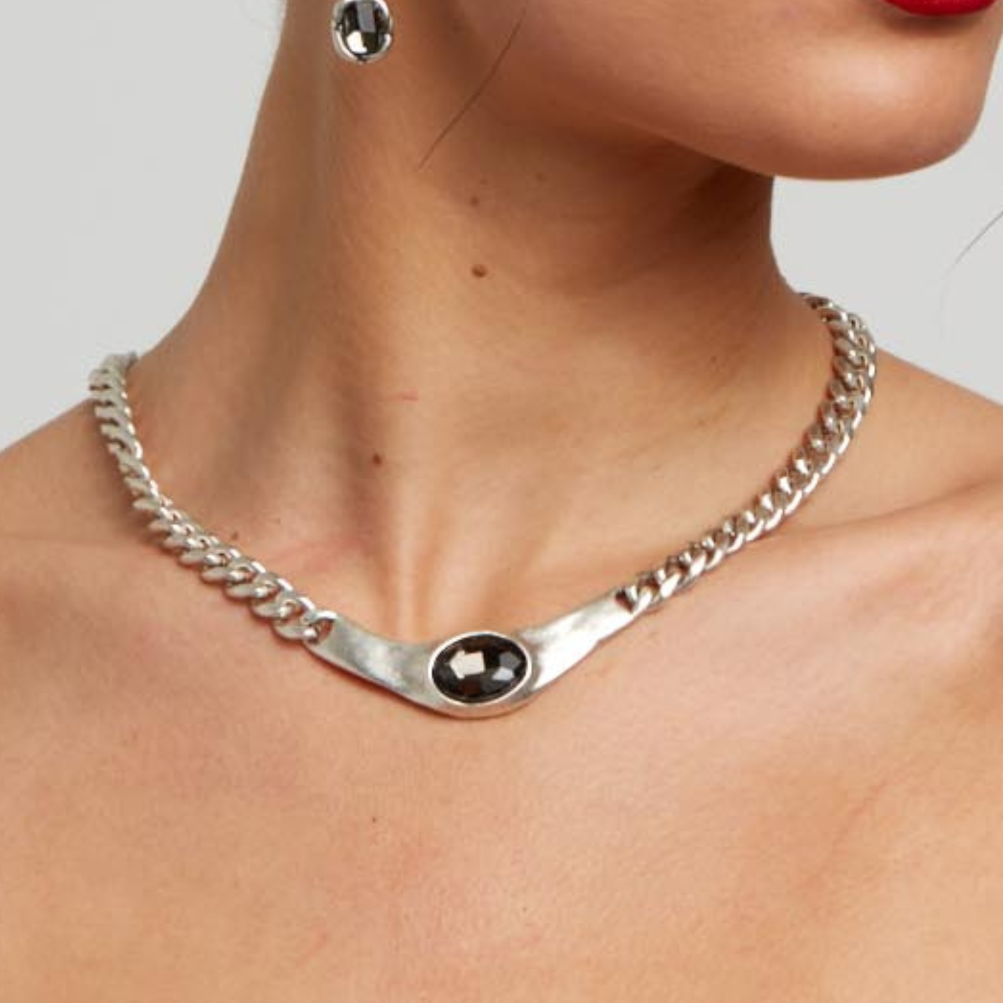 Handmade smoky crystal necklace by Chanour featuring a polished, semi-transparent dark gemstone pendant on a delicate chain.