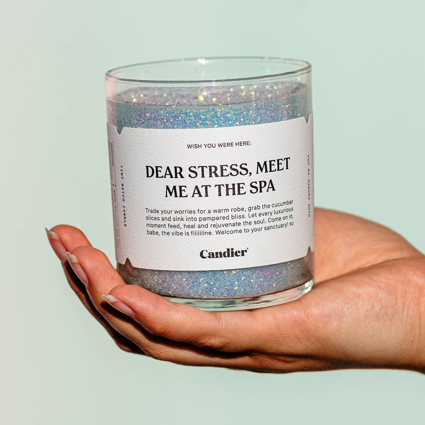 Candier Meet Me At The Spa candle with a white jar and label, designed for relaxing spa ambiance.