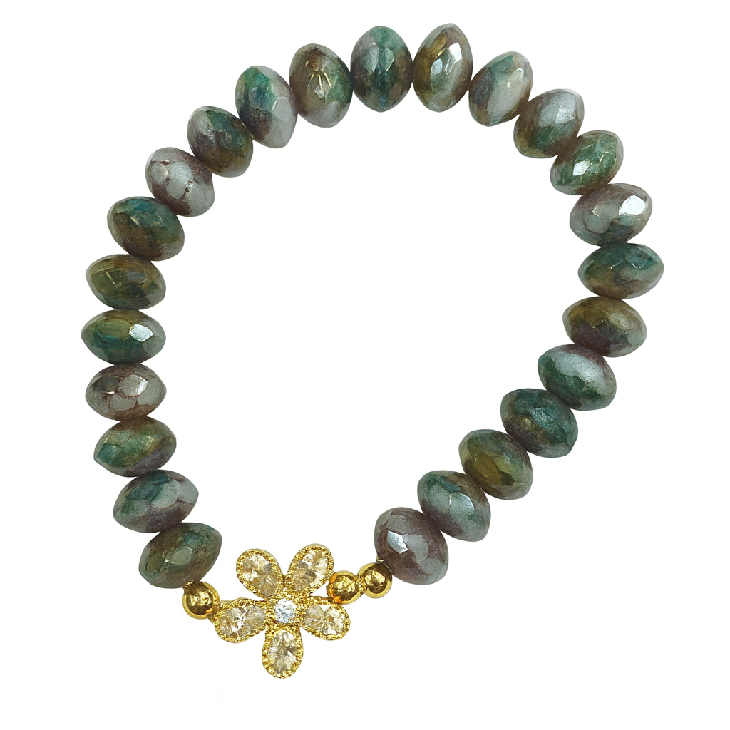 Beaded bracelet with a gold flower-shaped clasp on a white background