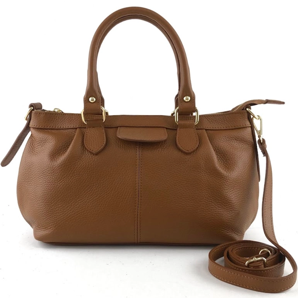 Brown leather handbag with a strap on a white background