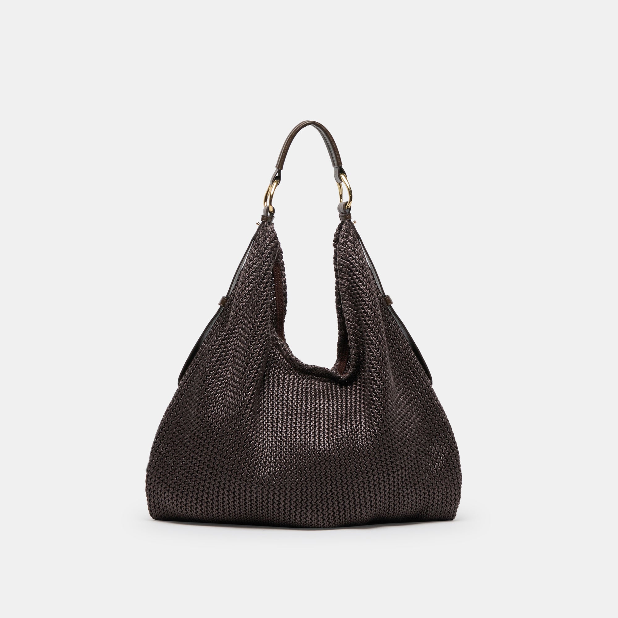 Dolce Vita Miriel tote bag made of natural raffia material, featuring a spacious design and woven texture.