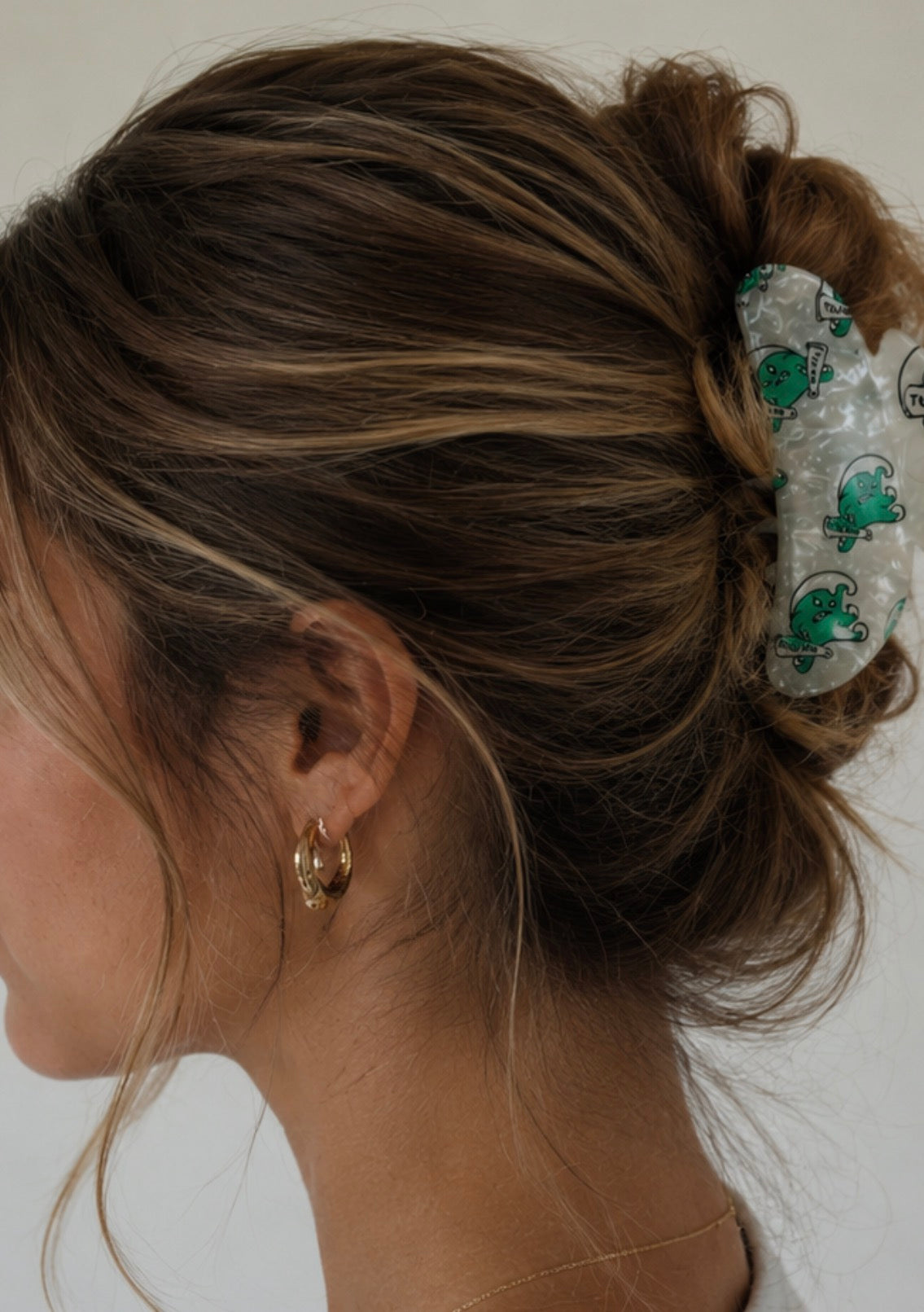 Private label college hair clips shown in various styles, perfect for securing hair with a fashionable touch.