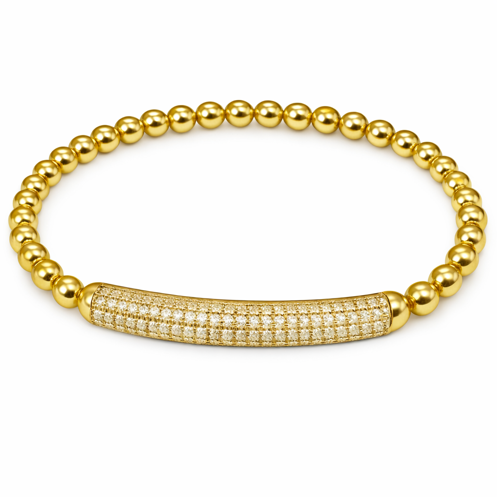Gold beaded bracelet with a diamond-studded clasp by The Skylar Project on a white background.