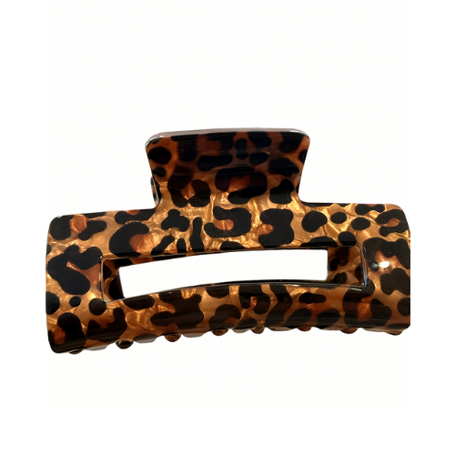 Leopard print hair clip on a white background