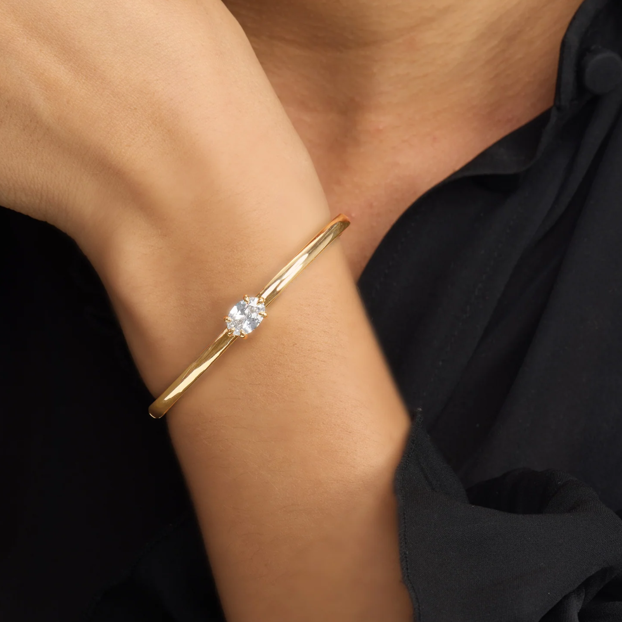 Melinda Maria She's on Point cuff bangle with a sleek, modern design featuring a polished gold finish.