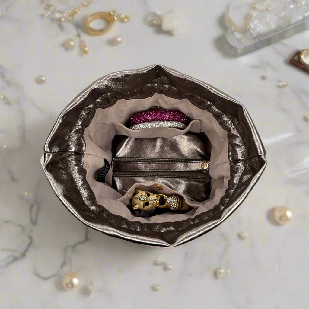 PurseN Oprah's Favorite Things 2021 bronze jewelry case with compartments for organizing rings, necklaces, and earrings.