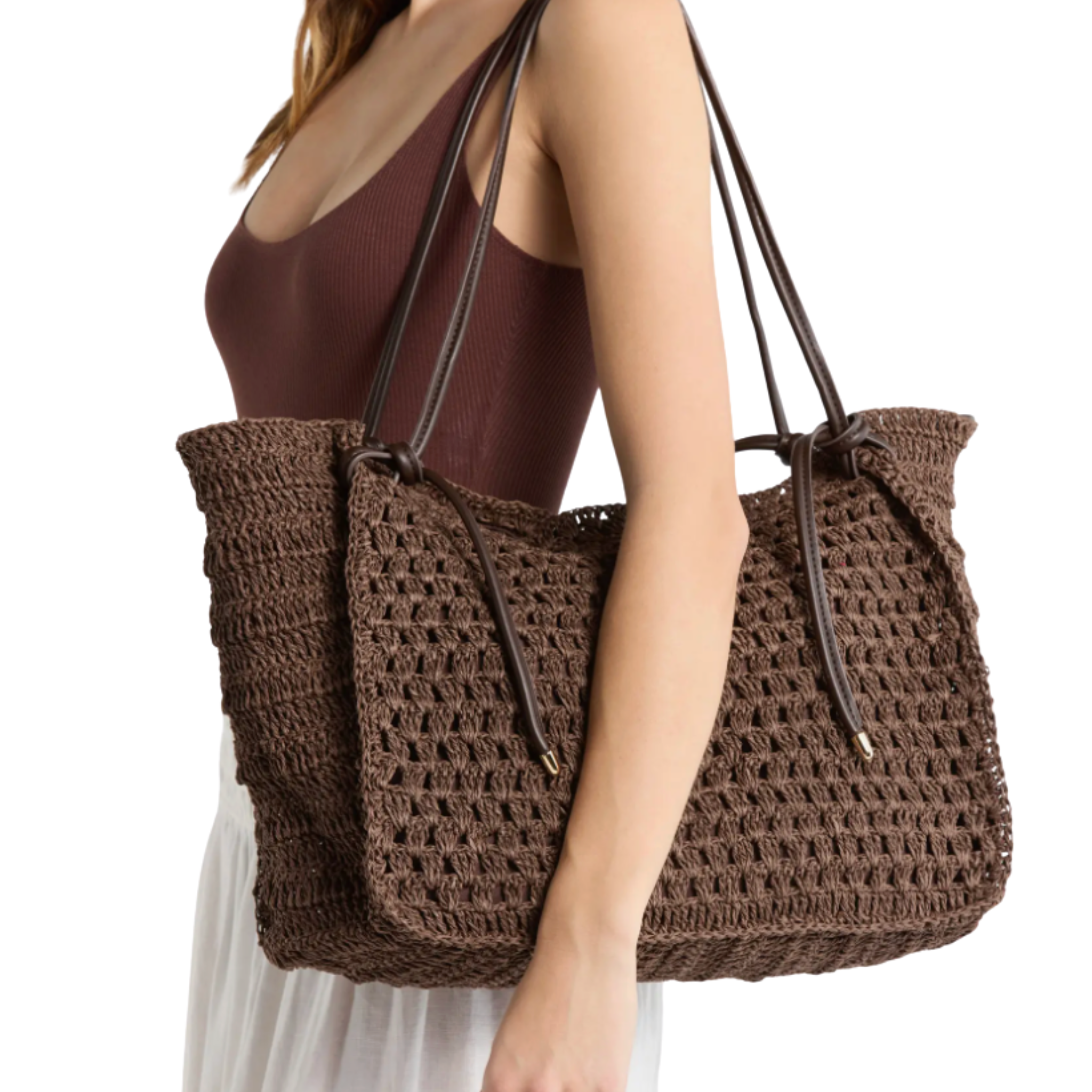 Colorful Dolce Vita Ravello Shopper Bag, a stylish beach bag with multicolor daisies, perfect for summer outings.