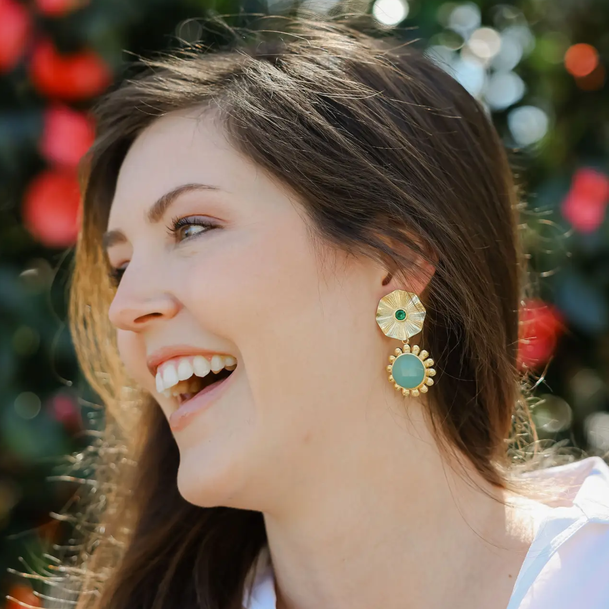 Colorful gemstone earrings by Private Label featuring multicolored gemstones and a stylish clip-on design.