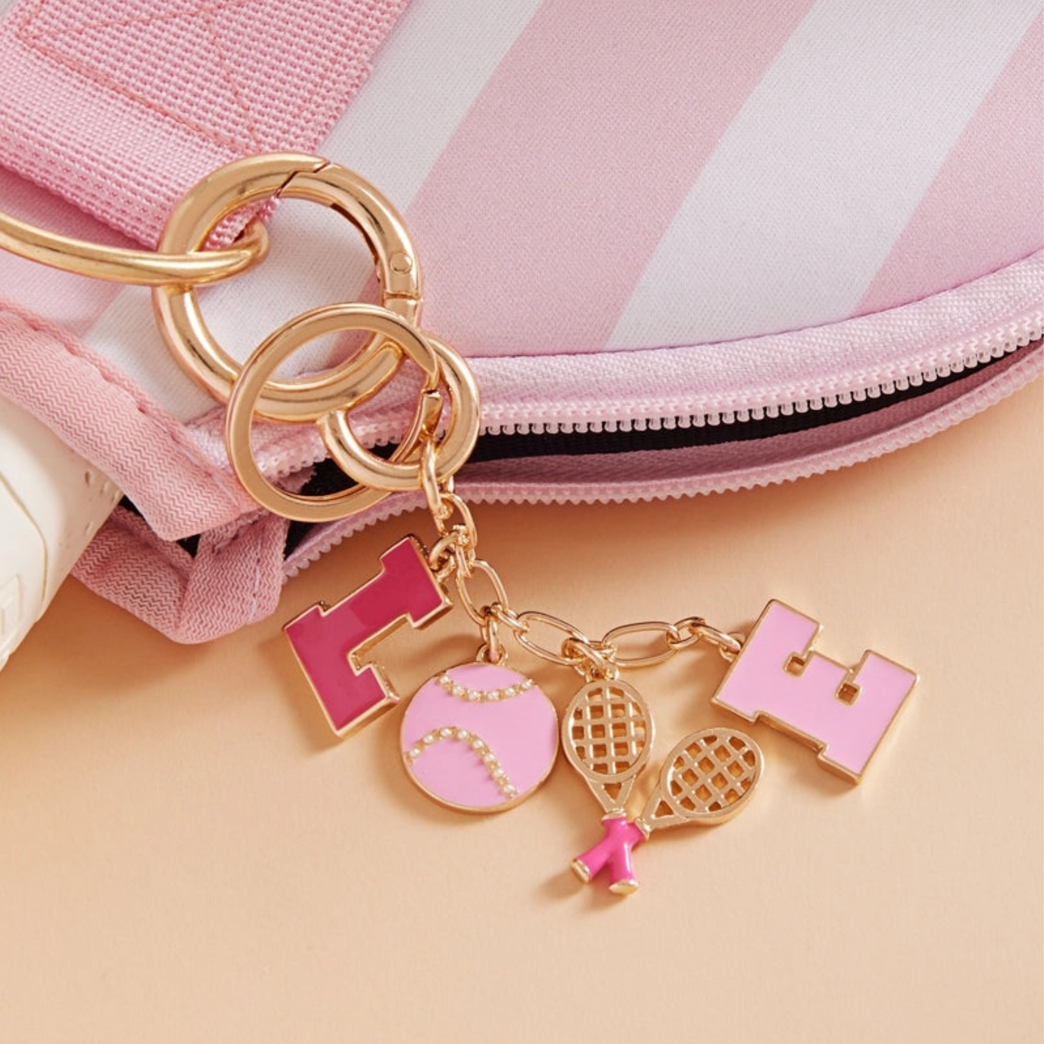 Multicolor tennis icon bag charm and keychain by Private Label, featuring sporty tennis ball and racquet design.